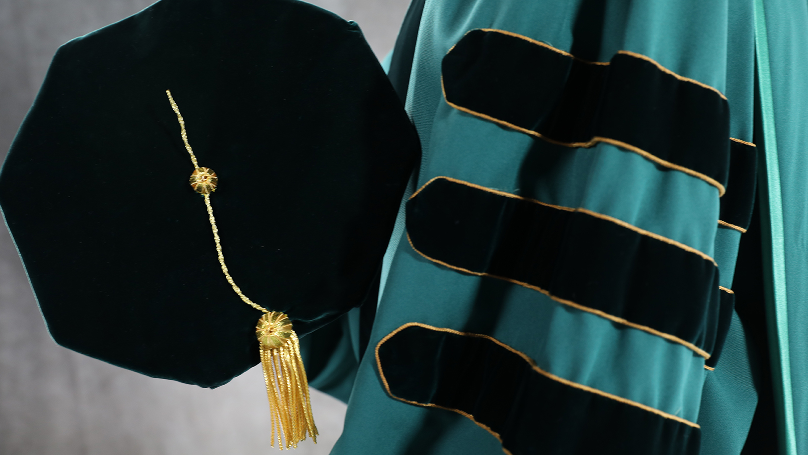 Doctoral cap and gown.