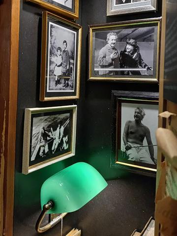 Einstein's locker, filled with old photos and a lamp.