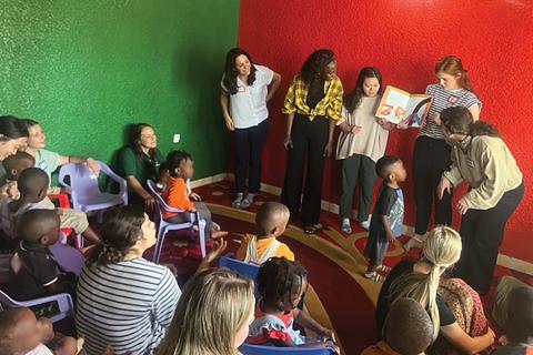 Baylor CSD students read to children enrolled in Africa New Life’s Dream Daycare.