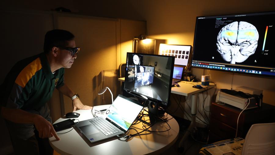 Jungjun Park, PhD, examines a brain scan in the BANDA research lab.