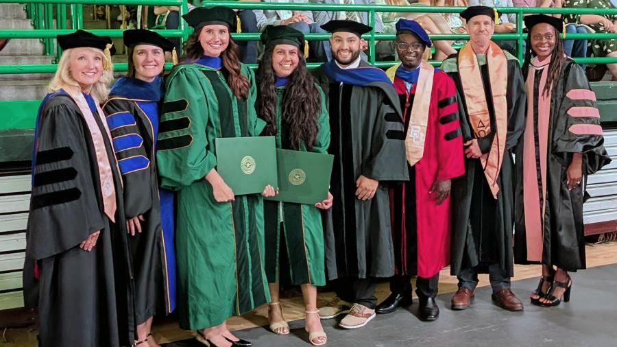 Baylor Public Health faculty celebrate the program's inaugural PhD graduates during Fall 2025 Commencement. 