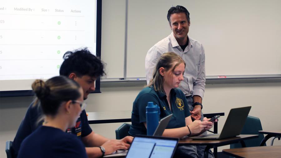 Andrew R. Meyer, PhD, leads a class discussion in his "Religion and Sport" course. 