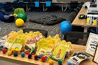 Sensory room with equipment on floor and sensory bags on table. 