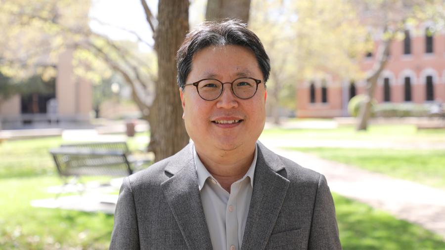 Dr. Jay Yoo, with Baylor University campus in the background.